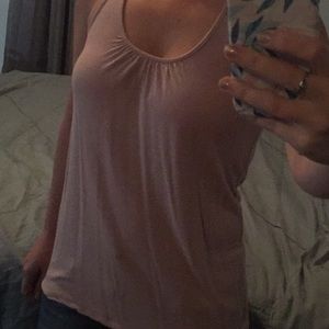 Woman’s small light pink tank. Cute back